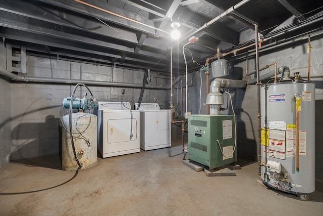 basement featuring water heater and separate washer and dryer