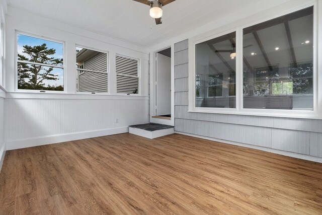 interior space with hardwood / wood-style floors and ceiling fan