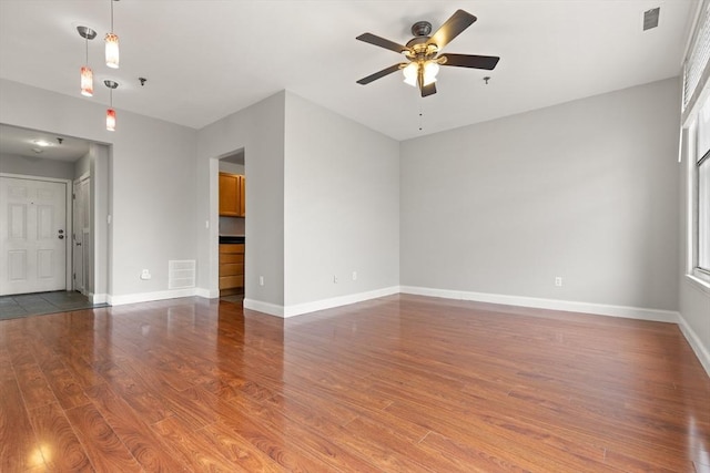 80 Wingate St Unit 3C, Haverhill, MA 01832 - spare room with a ceiling fan, wood finished floors, baseboards, and fire sprinkler in ceiling