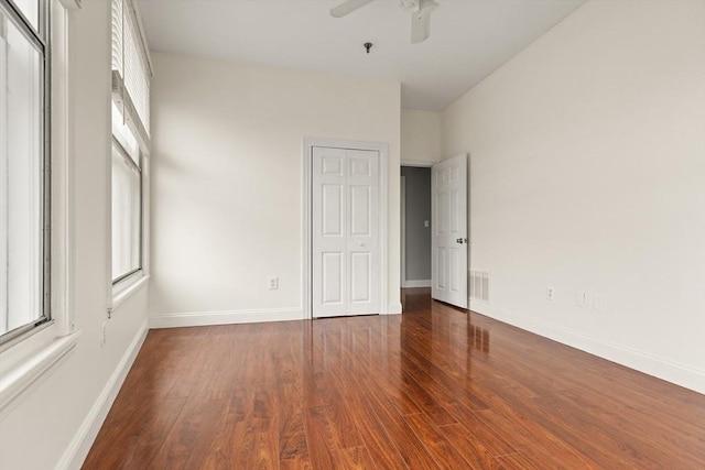 80 Wingate St Unit 3C, Haverhill, MA 01832 - unfurnished bedroom featuring wood finished floors, multiple windows, and baseboards