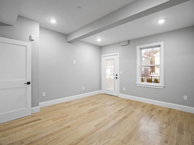 unfurnished room with light hardwood / wood-style floors