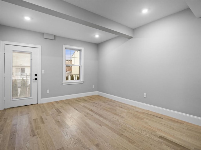 empty room with light hardwood / wood-style floors