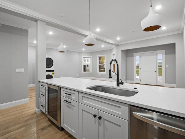 kitchen featuring light stone countertops, beverage cooler, sink, dishwasher, and light hardwood / wood-style floors