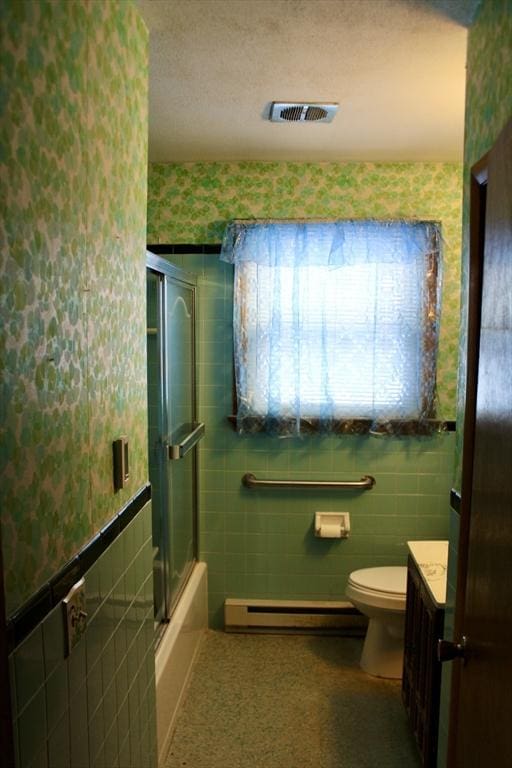 bathroom with wallpapered walls, visible vents, toilet, a baseboard radiator, and tile walls