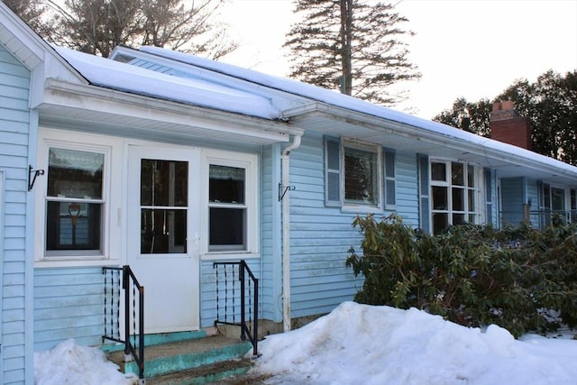 view of property exterior featuring a chimney