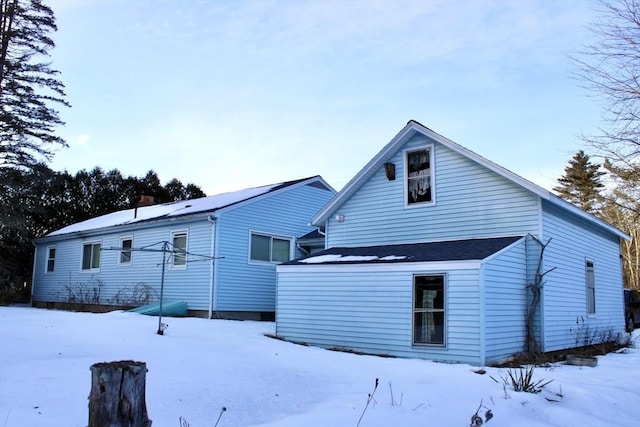 view of snow covered house