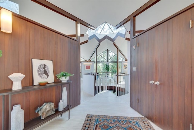 entrance foyer featuring wood walls