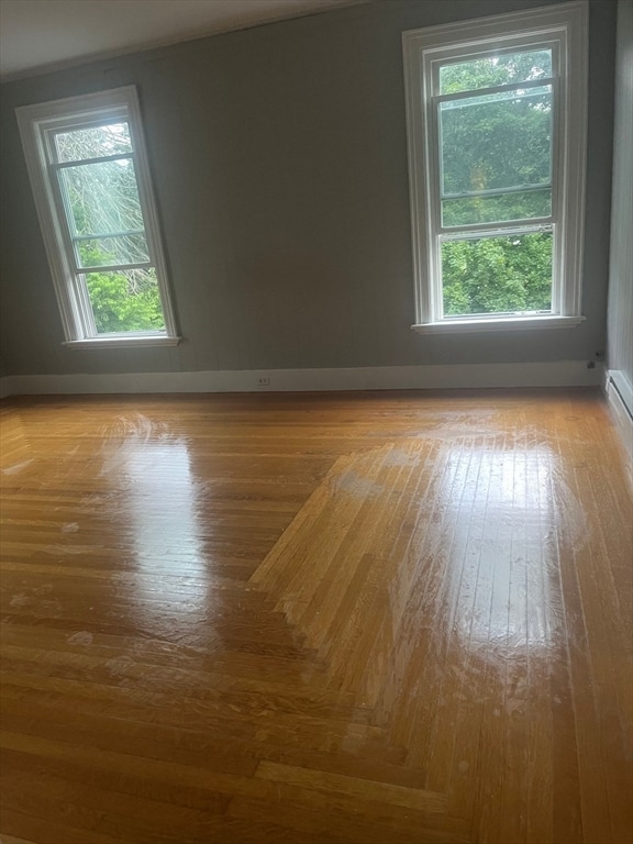 unfurnished room with light hardwood / wood-style flooring