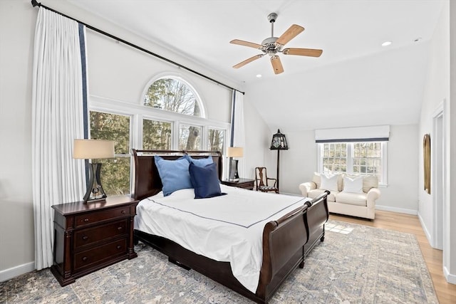 bedroom with lofted ceiling, recessed lighting, light wood-style flooring, ceiling fan, and baseboards