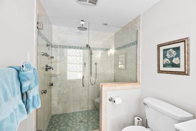 full bath featuring toilet, a shower stall, and visible vents