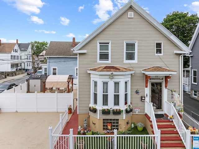 39 Crapo St, New Bedford, MA 02740 - view of front of house featuring a fenced front yard and a shingled roof