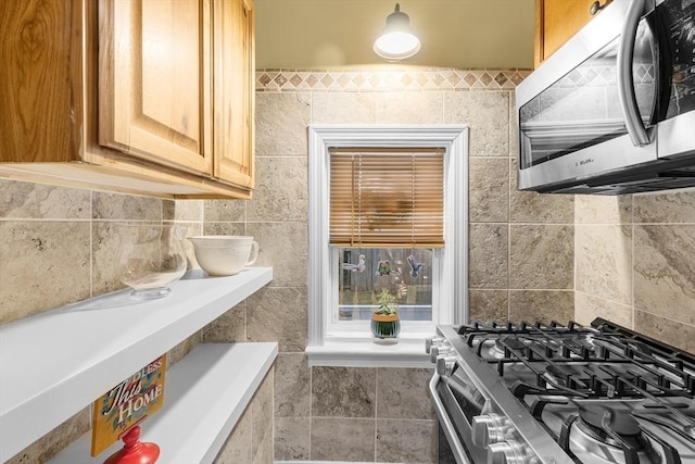 39 Crapo St, New Bedford, MA 02740 - kitchen with appliances with stainless steel finishes, light brown cabinetry, and tile walls
