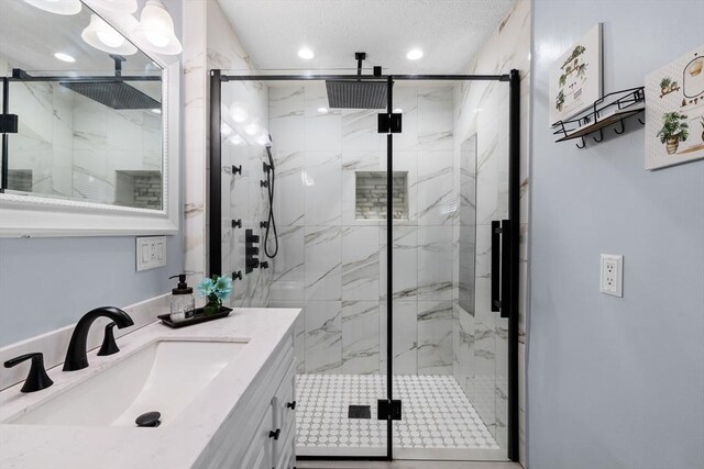 39 Crapo St, New Bedford, MA 02740 - full bathroom with a marble finish shower, vanity, and recessed lighting