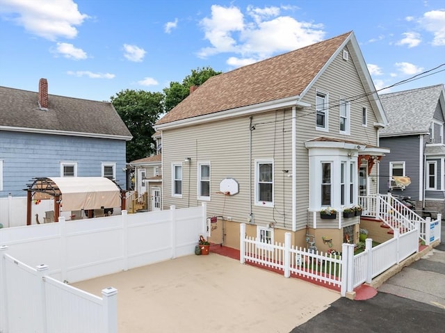 39 Crapo St, New Bedford, MA 02740 - rear view of house featuring a patio area and roof with shingles