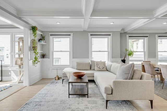 27 Central Rd Unit 1, Somerville, MA 02143 - living area with coffered ceiling, beamed ceiling, plenty of natural light, light wood-style floors, and ornamental molding