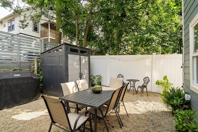 27 Central Rd Unit 1, Somerville, MA 02143 - fenced backyard featuring outdoor dining area, a patio, and grilling area