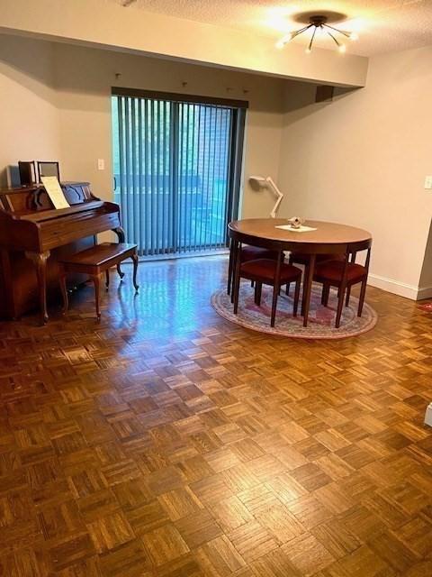 51 John St Unit 201, Brookline, MA 02446 - dining area featuring baseboards