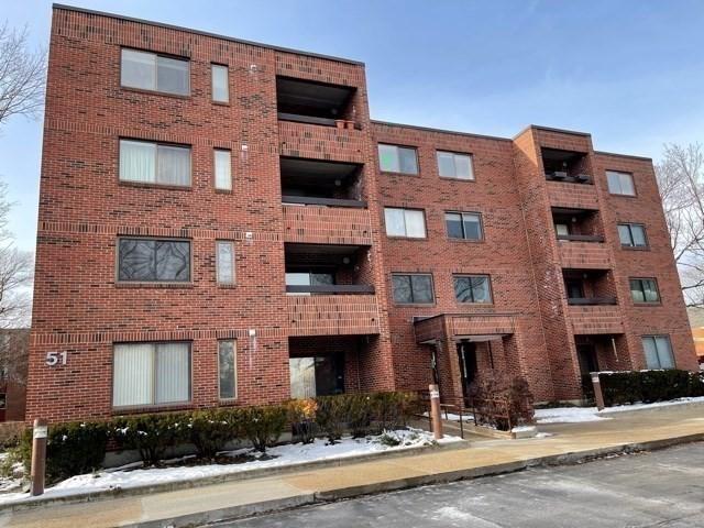 51 John St Unit 201, Brookline, MA 02446 - snow covered property with a view of apartment building / complex