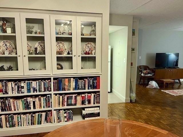 51 John St Unit 201, Brookline, MA 02446 - detailed view of freestanding refrigerator and a textured ceiling