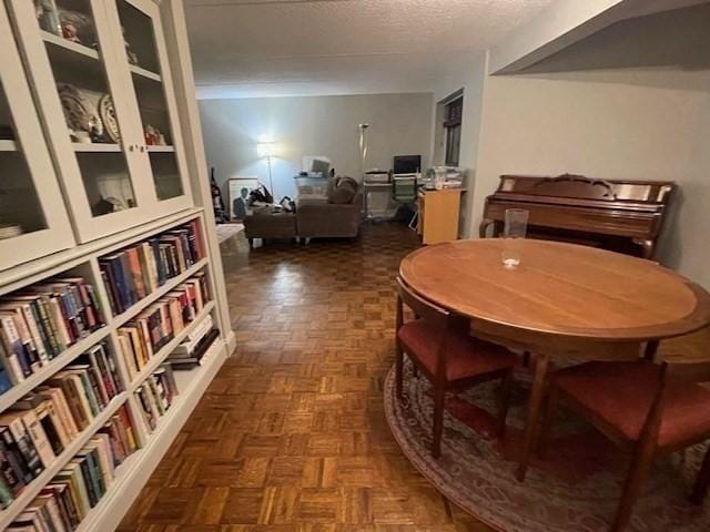 51 John St Unit 201, Brookline, MA 02446 - dining space with a textured ceiling