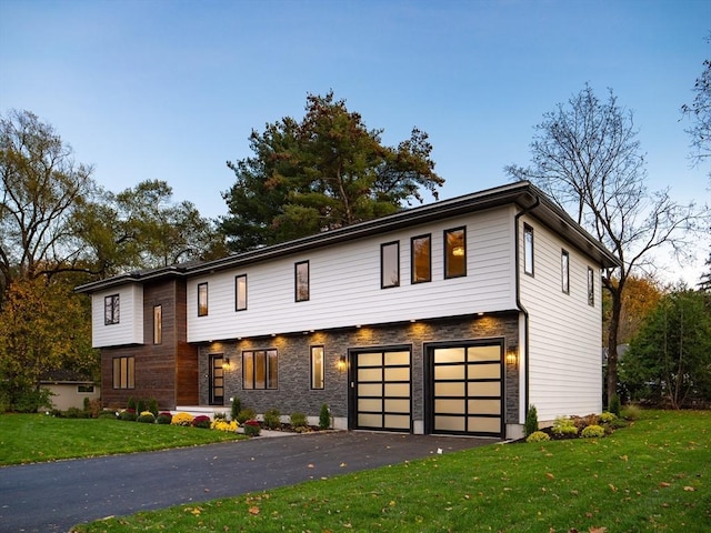 1 Liberty, Natick, MA 01760 - view of front of house featuring a garage and a front lawn