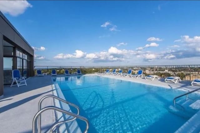 view of pool featuring a patio area