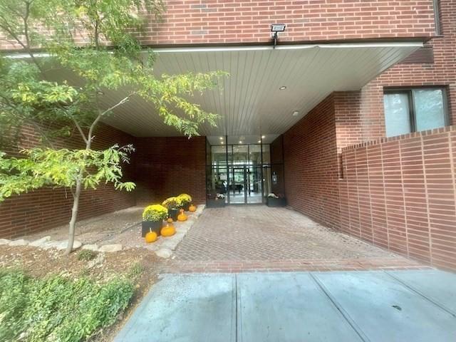 property entrance with a carport