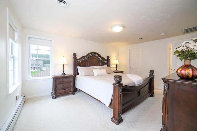 10 Morgan Cir, Holden, MA 01520 - bedroom with baseboard heating, light colored carpet, and baseboards