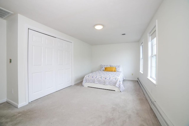 10 Morgan Cir, Holden, MA 01520 - carpeted bedroom with baseboards, a closet, and baseboard heating