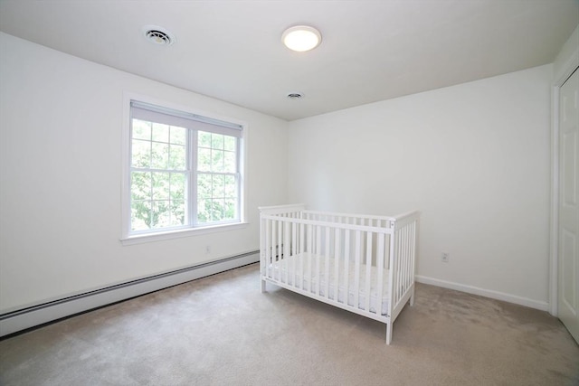 10 Morgan Cir, Holden, MA 01520 - carpeted bedroom featuring a baseboard heating unit and baseboards