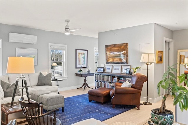 living room with ceiling fan, hardwood / wood-style floors, and a wall mounted air conditioner