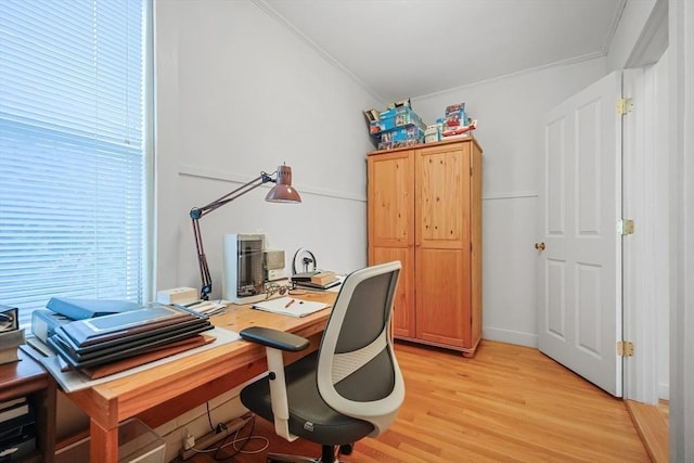 office space featuring light wood-style floors and ornamental molding