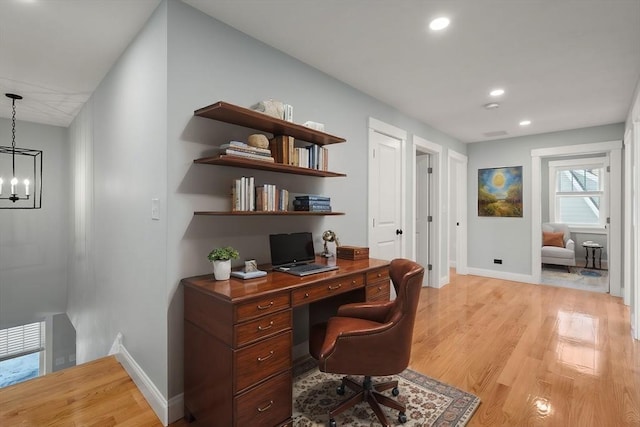 home office featuring light wood-type flooring, an inviting chandelier, baseboards, and recessed lighting