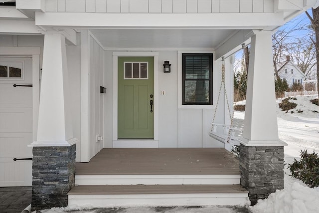 view of snow covered property entrance