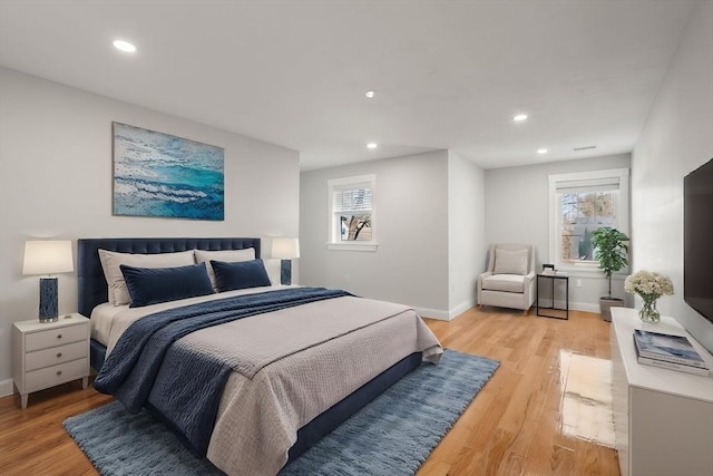 bedroom featuring light wood-style flooring, baseboards, and recessed lighting