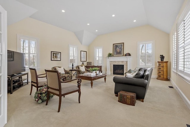 living room featuring light colored carpet and lofted ceiling