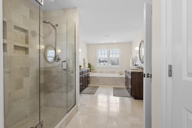 bathroom featuring vanity, tile patterned floors, and shower with separate bathtub