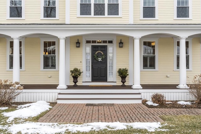 view of snow covered property entrance