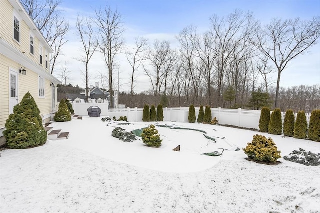 view of yard covered in snow