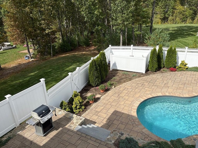 view of patio with a fenced in pool and grilling area