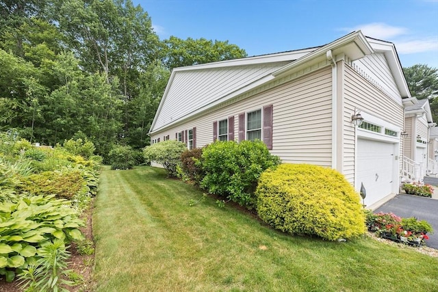 51 Spruce St Unit 51, Northbridge, MA 01534 - view of property exterior with a yard and asphalt driveway