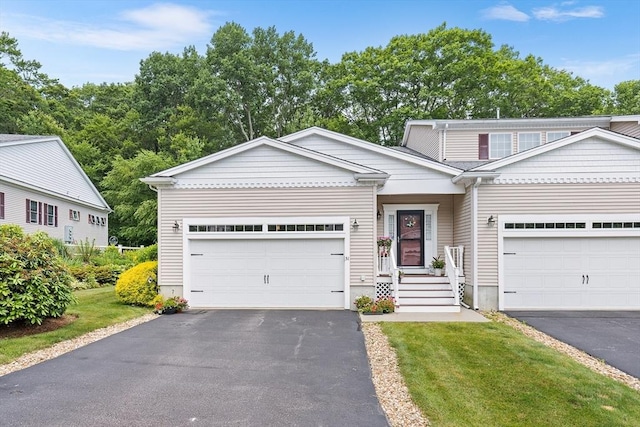 51 Spruce St Unit 51, Northbridge, MA 01534 - view of front facade with driveway, a garage, and a front yard