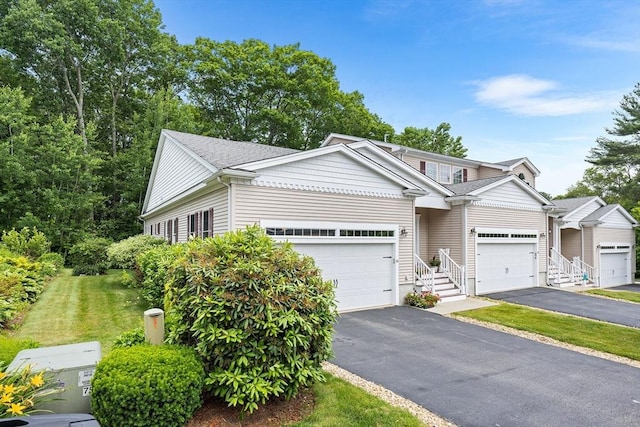 51 Spruce St Unit 51, Northbridge, MA 01534 - view of front facade featuring asphalt driveway and a front yard