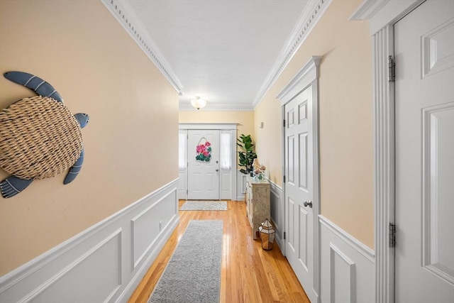 51 Spruce St Unit 51, Northbridge, MA 01534 - entryway with crown molding, wainscoting, light wood finished floors, and a decorative wall