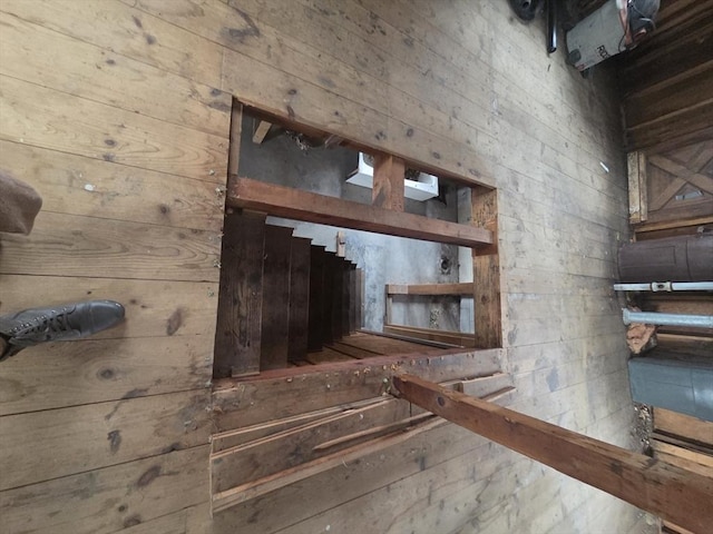 stairs with wood walls