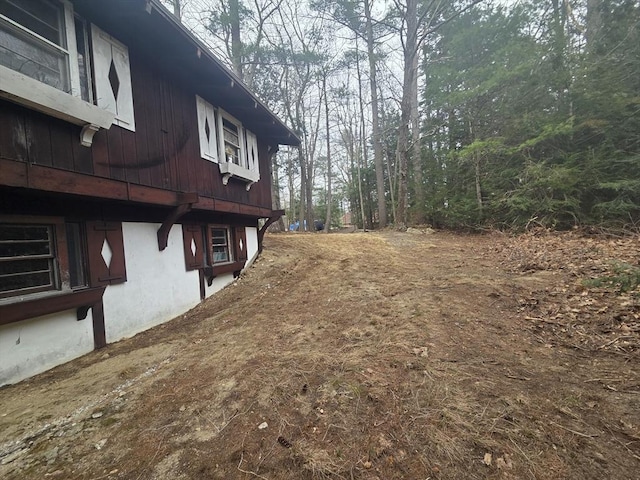 view of side of home featuring stucco siding