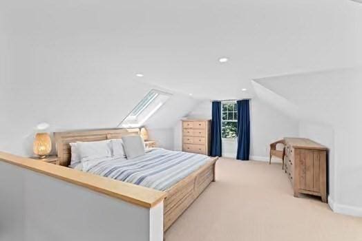 65 Myles View Dr, Duxbury, MA 02332 - carpeted bedroom with lofted ceiling, a skylight, and recessed lighting
