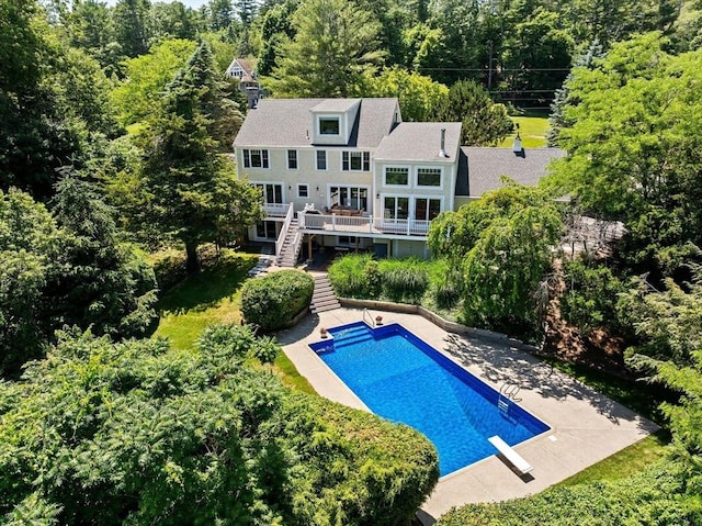 65 Myles View Dr, Duxbury, MA 02332 - swimming pool with stairs, a wooden deck, and a diving board