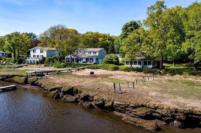 back of house with a water view