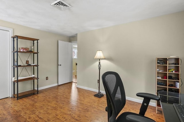 home office featuring hardwood / wood-style floors